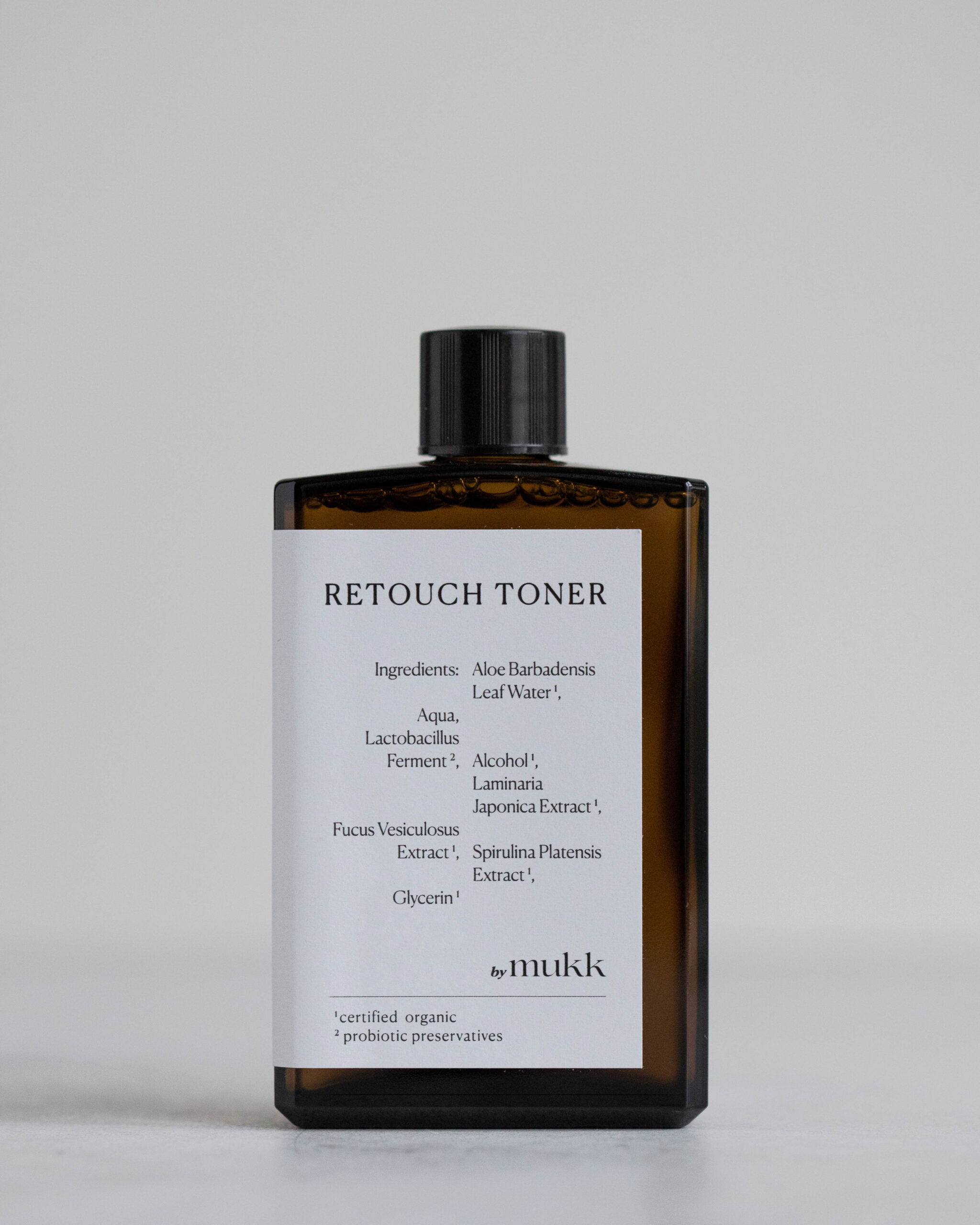 by mukk Retouch Toner - toner s řasami a probiotiky